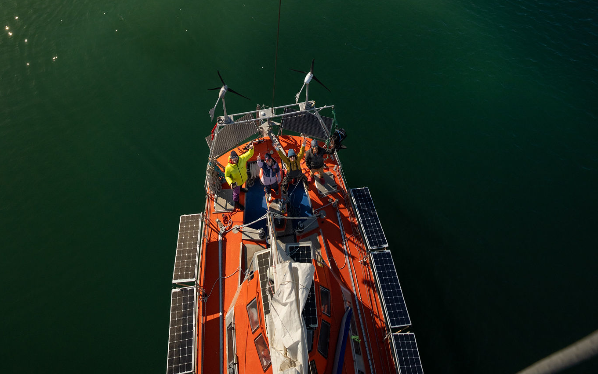 Arial shot of the crew on the solar powered sailboat.