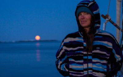 Rachael in in the moonlight on the sailboat.