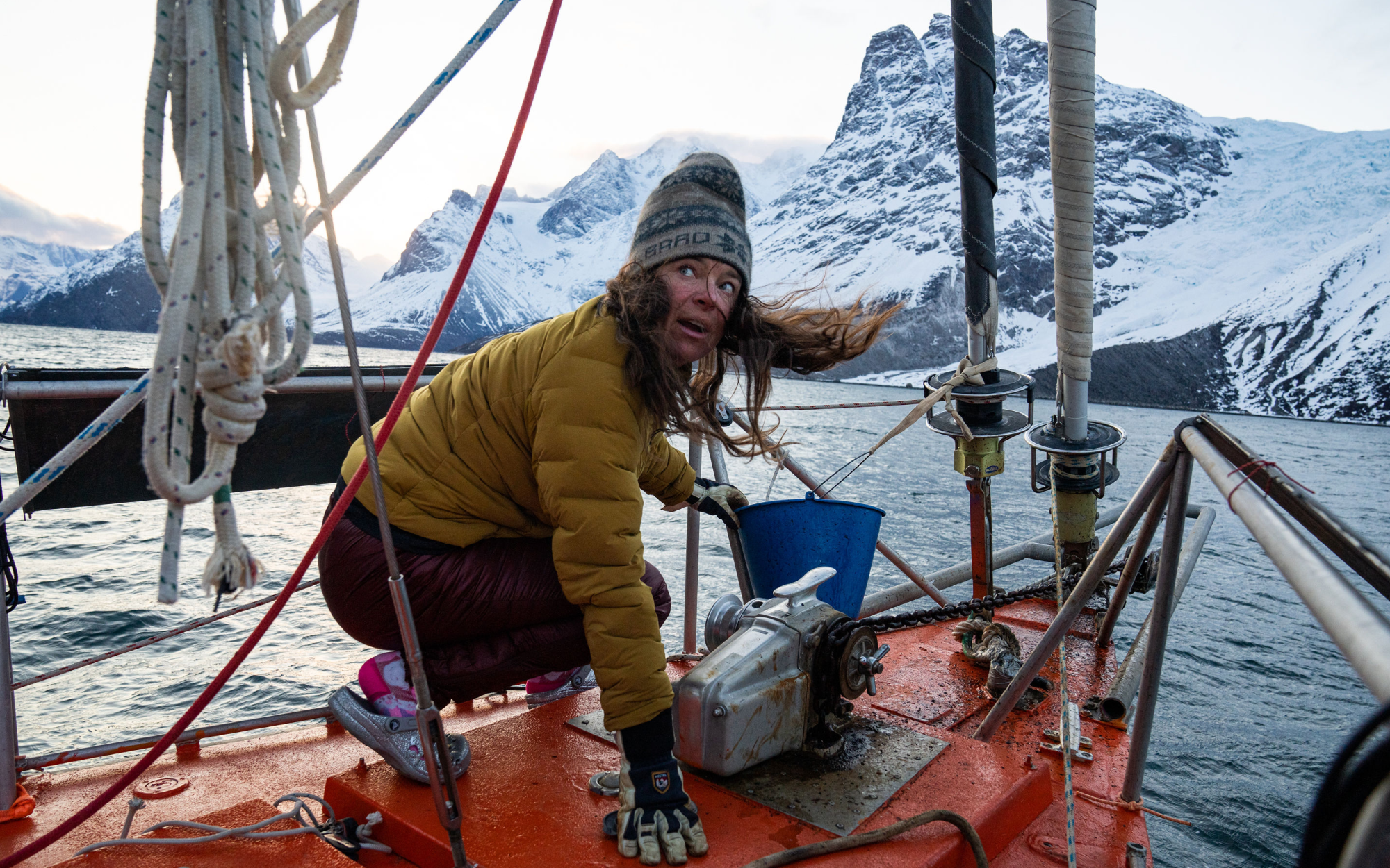 Rachael on the sailboat in Greenland, taking in her breathtaking surroundings.