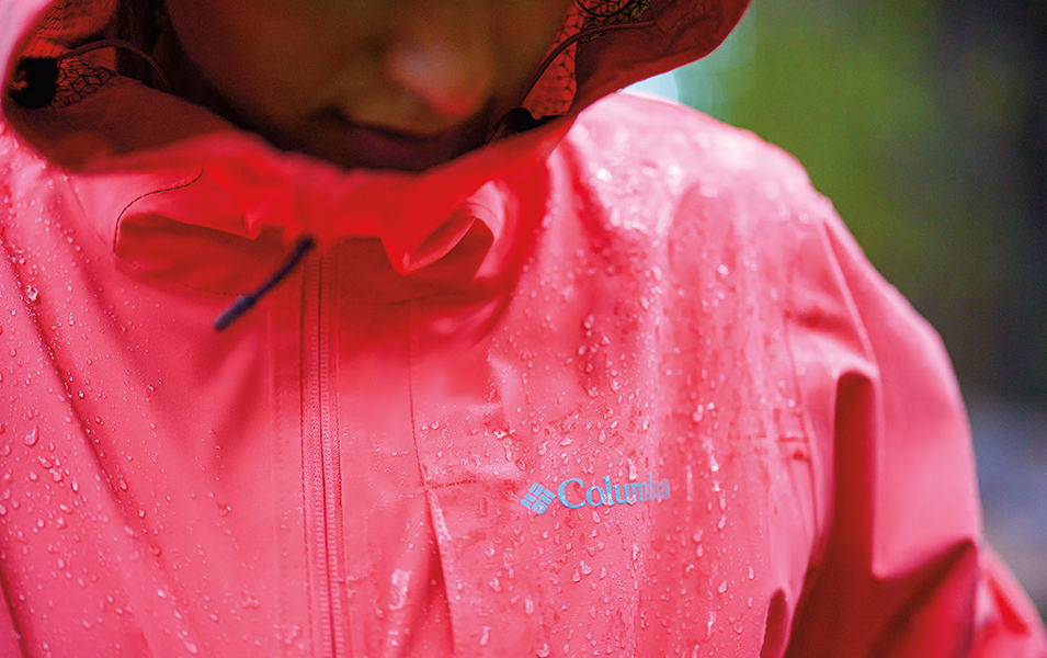 A close-up shot of a red Columbia Sportswear Omni-Tech™ jacket.