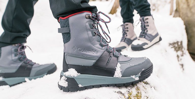 Woman in snow boots and leggings on legs, women's winter shoes