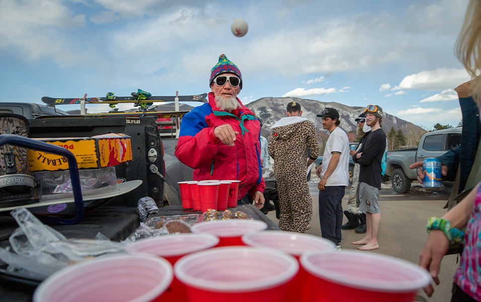Hotdog Hans is pictured playing beer pong in the parking lot of an Aspen ski resort.  

 