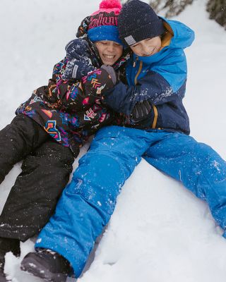 Kids hugging in the snow