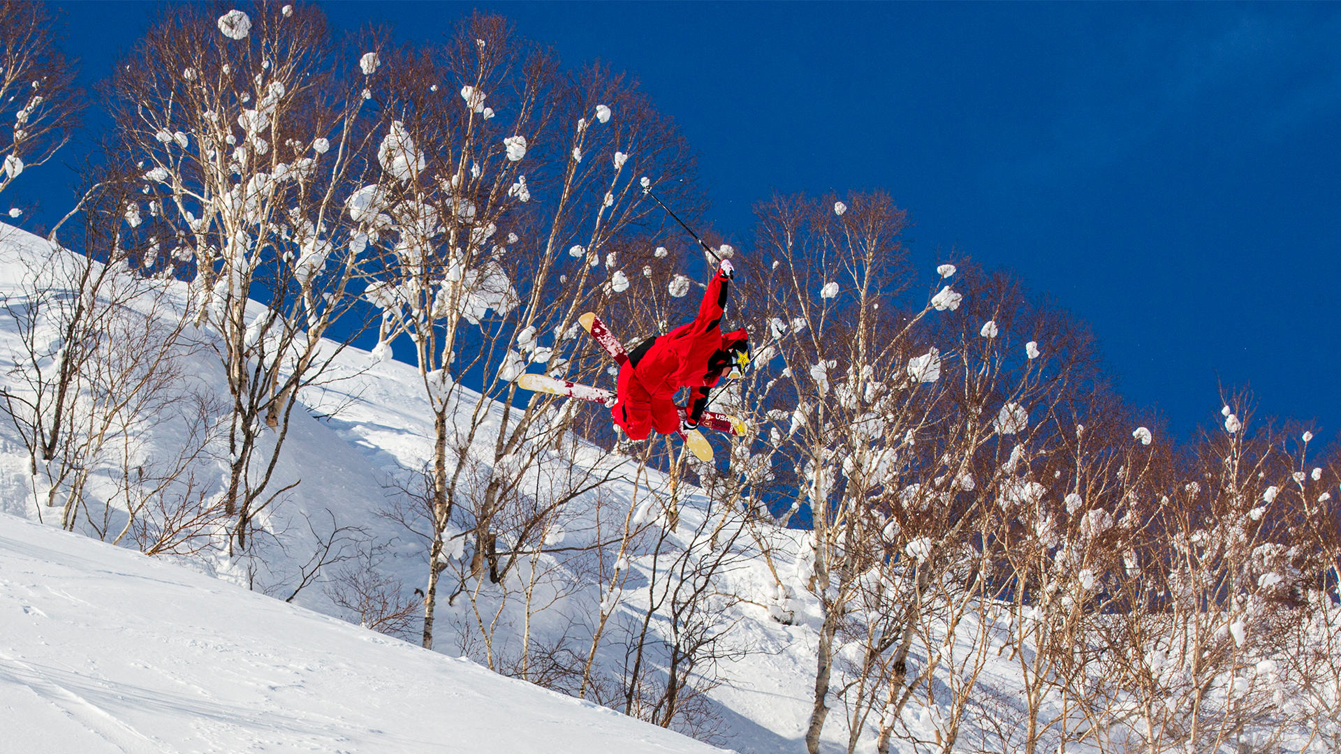 A woman skiing down a mountain slope. 