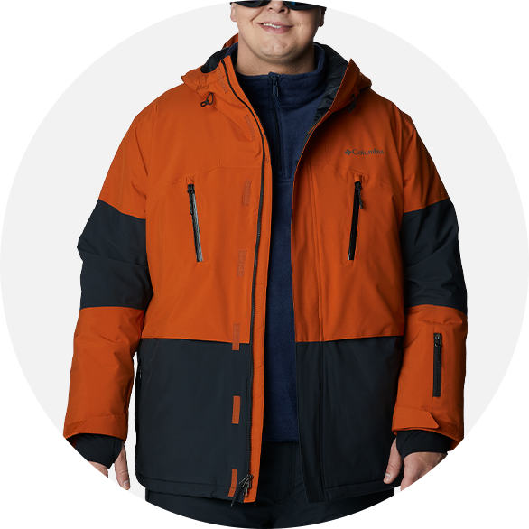 Man in an orange and black ski jacket.