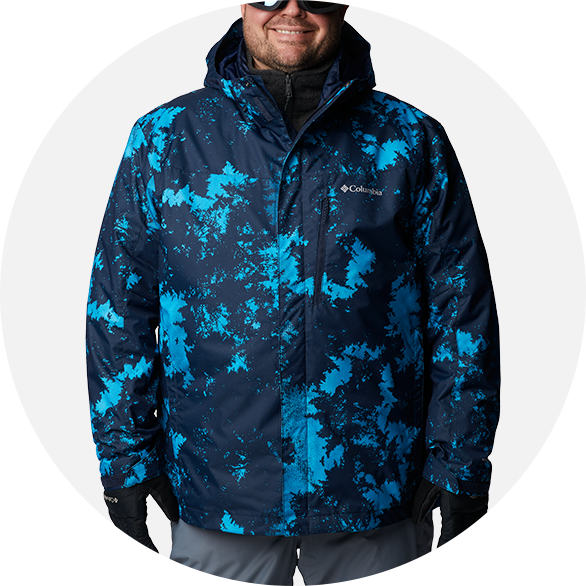 Man in a blue patterned 3-in-1 ski jacket.