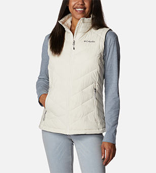 Woman in a white insulated vest.