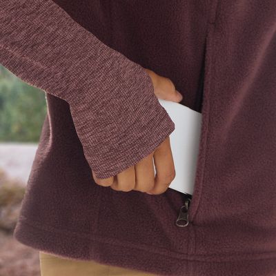 Model putting a phone in the zippered hand pocket.