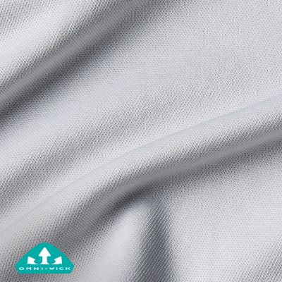 Close up of fabric with the Omni Wick logo in the bottom left and a graphic showing how moisture evaporates from the fabric's surface.