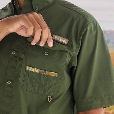 Close-up of model opening a chest pocket.