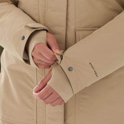 Model adjusting the cuff with the extended thumbhole cuffs over their hands.