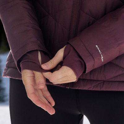 Model adjusting extended thumbhole cuffs over their hand.