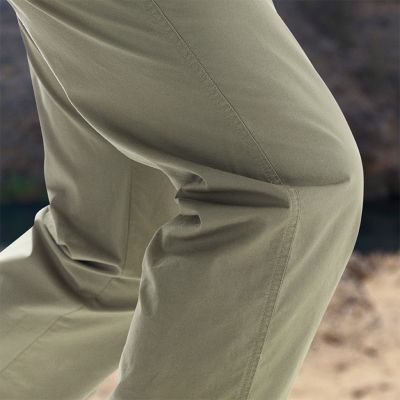 Close-up of the model's knees, showcasing the comfort stretch fabric.