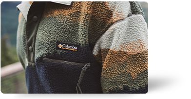 A woman in a colorful fleece.