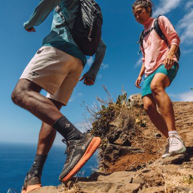 Hikers descending a rocky trail.