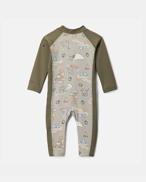 An infant's green sunsuit with a fun print.