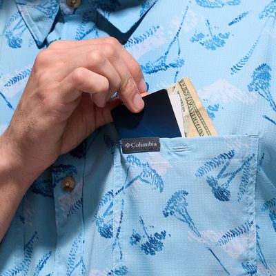 Close-up of cash and cards in a chest pocket.