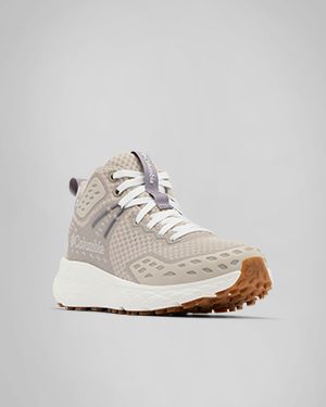 A single beige hiking shoe.