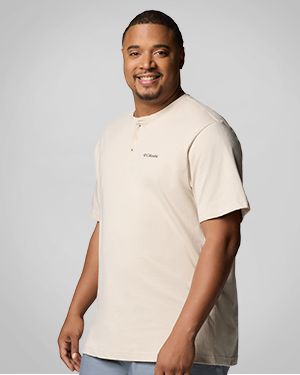 A man wearing a dark green t-shirt.