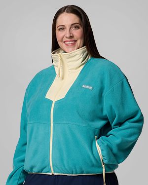 A person wearing a blue zip-up fleece jacket.
