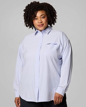 A woman wearing a blue long sleeve shirt.