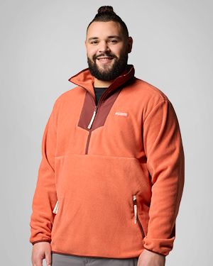 A man wearing an orange fleece zip-up.
