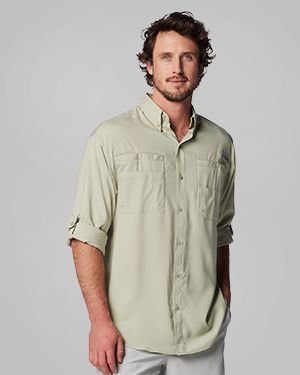A man wearing a light green long-sleeve button-up.