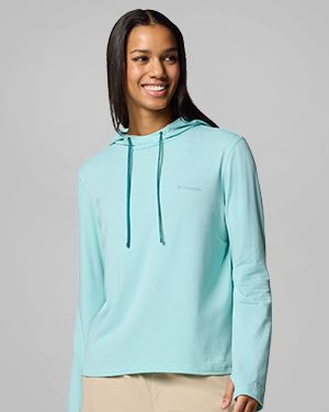 A woman wearing a teal hoodie.