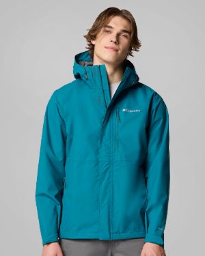 A man wearing a teal jacket.