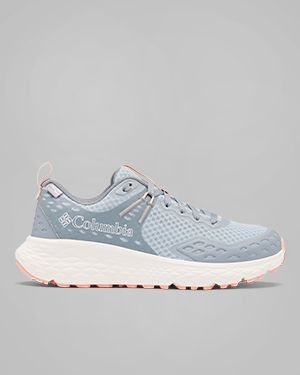 A person wearing grey hiking shoes.