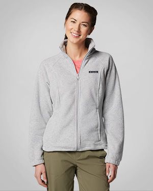 Woman wearing a grey fleece jacket.