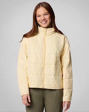 Woman wearing a yellow insulated jacket.