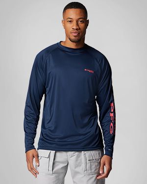 Man wearing a dark blue long-sleeve PFG shirt.