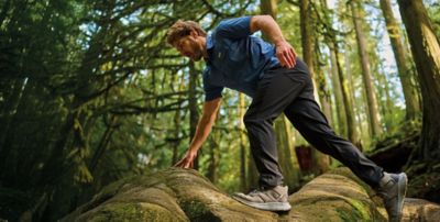 A man hiking in a forest.