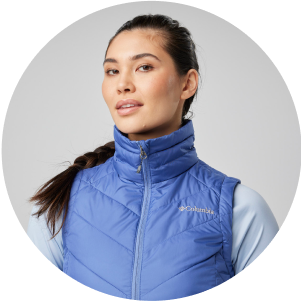 A woman in a puffy vest.