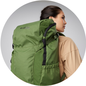 A woman with a large backpacking pack on.