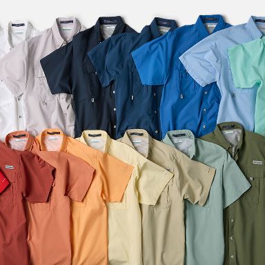 A spread of different colors of short sleeve shirts.