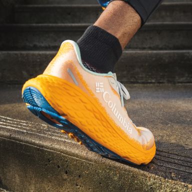 Close-up of running shoes on pavement.