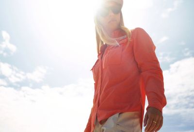 An angler standing in the sunlight.