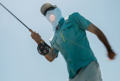 An angler reeling their line.