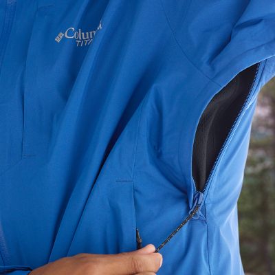 Model lifting up their arm to reveal the zippered, breathable underarm vents.