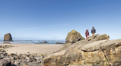 People walking on a beach.
