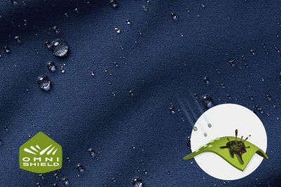 Close up of fabric with the Omni Shield logo in the bottom left and a graphic showing how moisture beads on the fabric's surface.