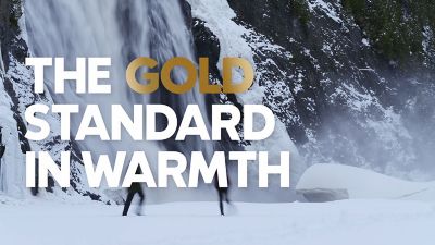 Video of two hikers in a winter wonderland by a waterfall in their Omni Heat Infinity jackets.