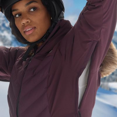 Model lifting up their arm to reveal the zippered, breathable underarm vents.
