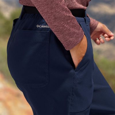 Close-up of a woman putting her hand into the pocket