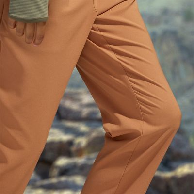 Close-up of a woman walking easily in the comfort stretch fabric