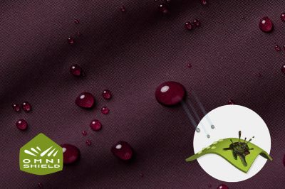 Close up of fabric with the Omni Shield logo in the bottom left and a graphic showing how moisture beads on the fabric's surface.