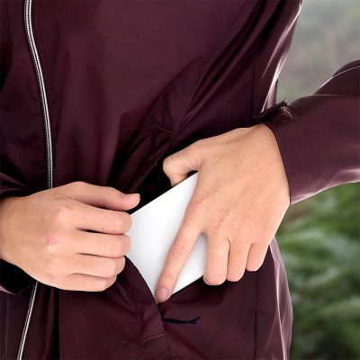 Model putting phone in pocket.