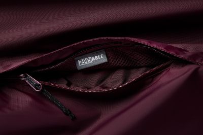 Close-up of unzipped packable pocket.